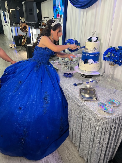 Quinceañera cutting cake at OCSalsa Events Venue and Banquet hall in Fountain Valley, CA