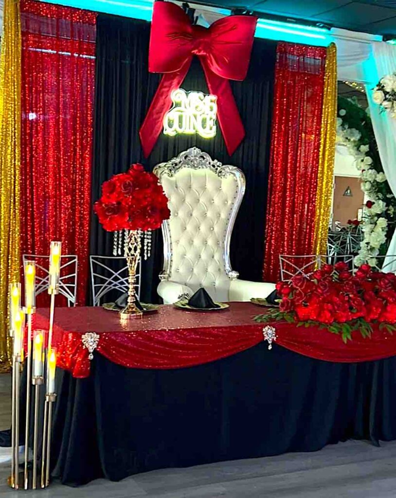 Quinceañera main table decorated black and red at Oc Salsa Banquet Hall and event venue in Fountain Valley, California