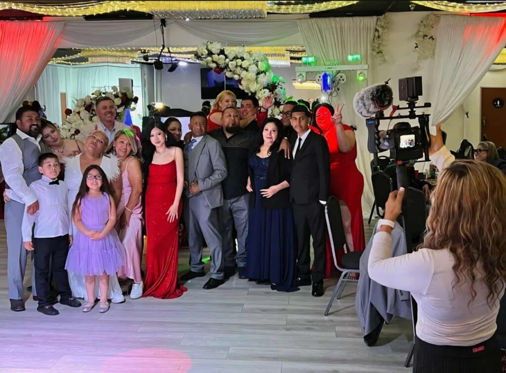 Family posing for pic at OC Salsa Venue & Banquet Hall in Fountain Valley