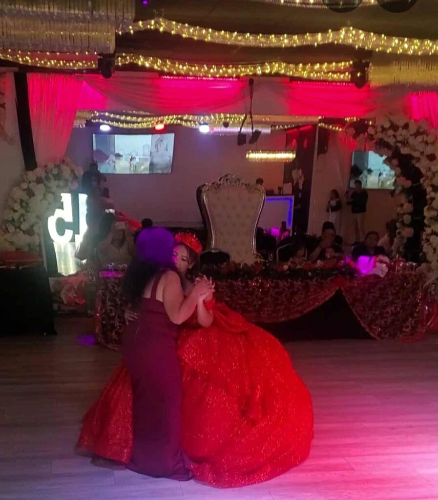 Quinceañera hug at OC Salsa Venue & Banquet Hall in Fountain Valley