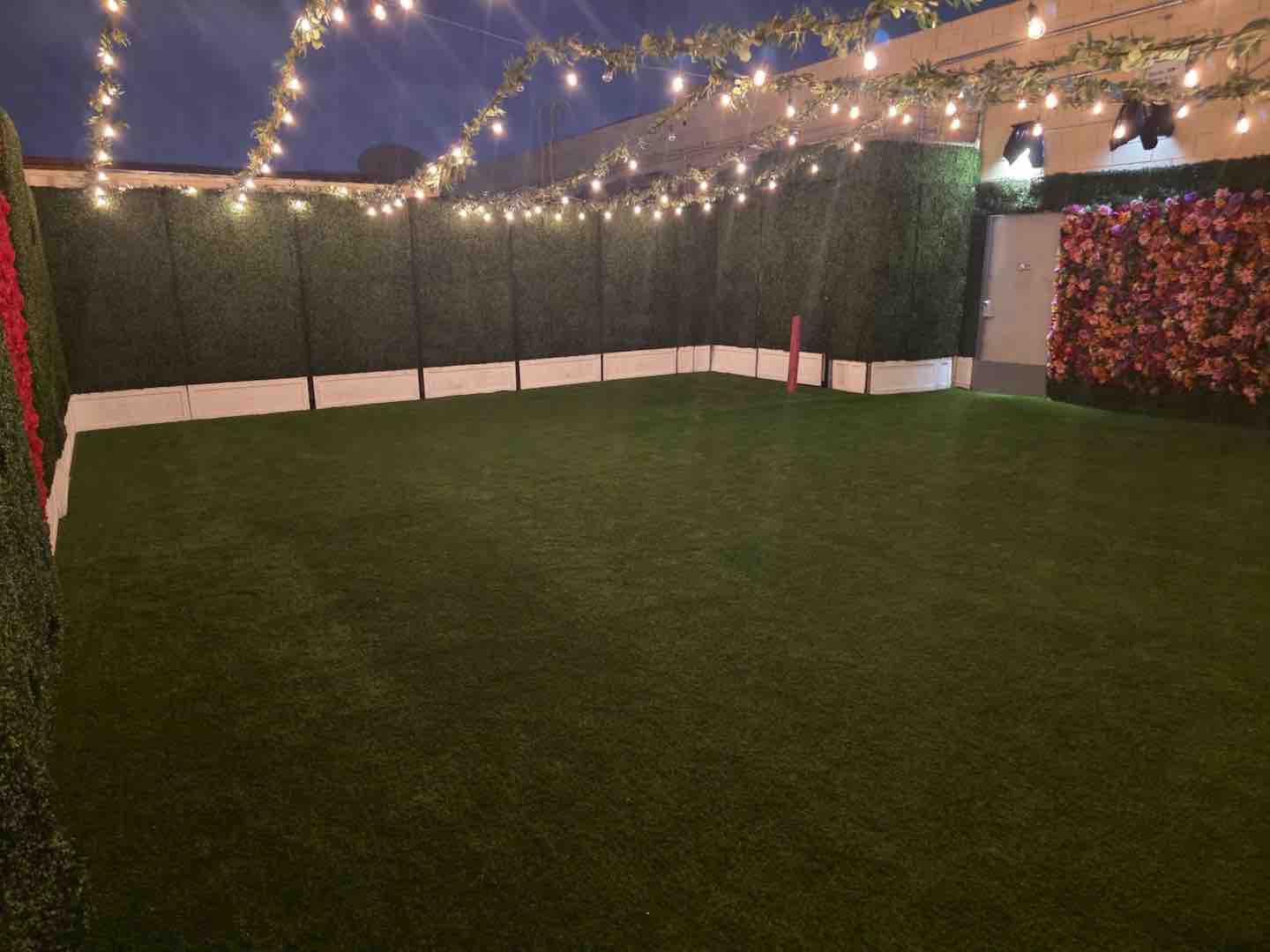 Decorative garden backdrop at OC Salsa Venue
