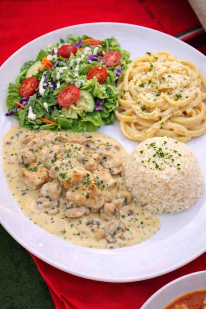 Mushroom Chicken, White Rice, Fettuccini Alfredo & Garden Salsa dinner plate at OC Salsa Venue