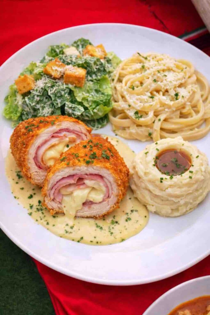 Stuffed breast cordon blue, fettuccini alfredo, Mashed potatoes and Ceasar salad plate at OC Salsa Venue