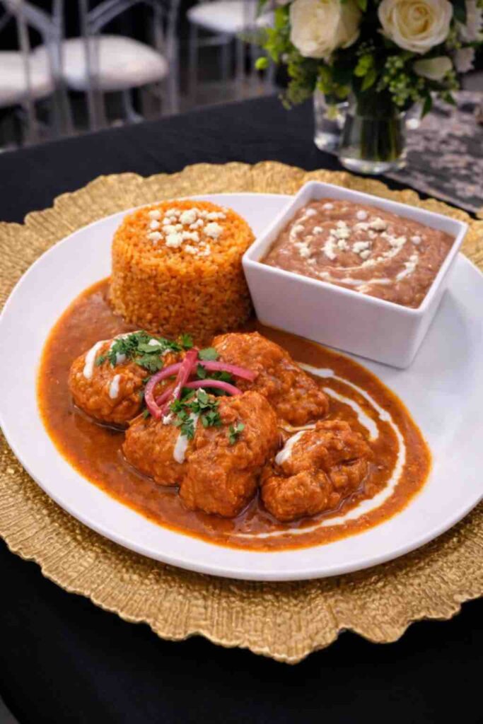 Chipotle Chicken, Red Rice & refried Beans diner plate at OC Salsa Venue