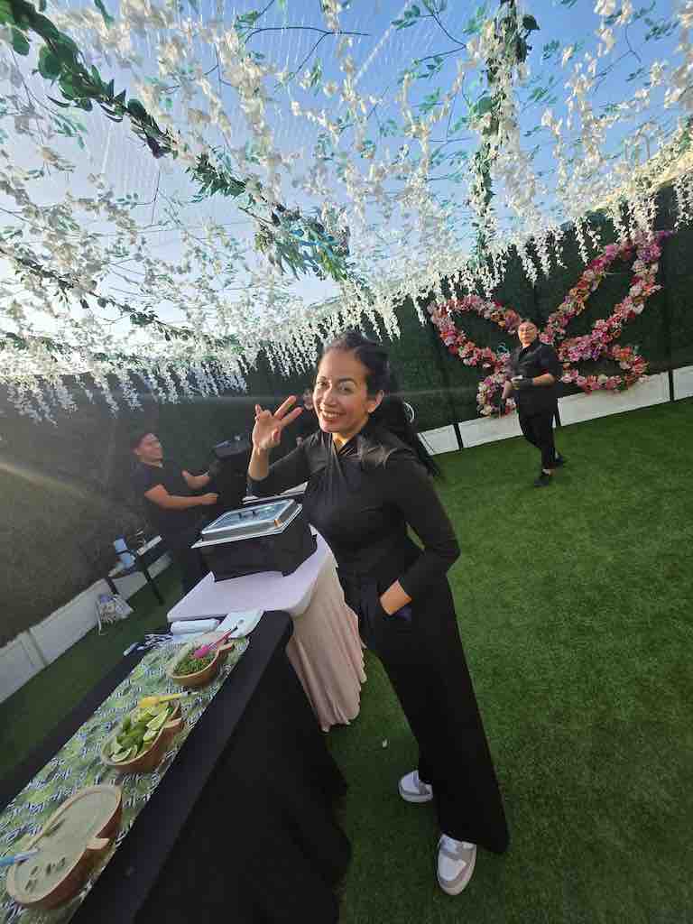 Lidiet, co-owner of OC Salsa Venue, personally helping clients plan their celebration