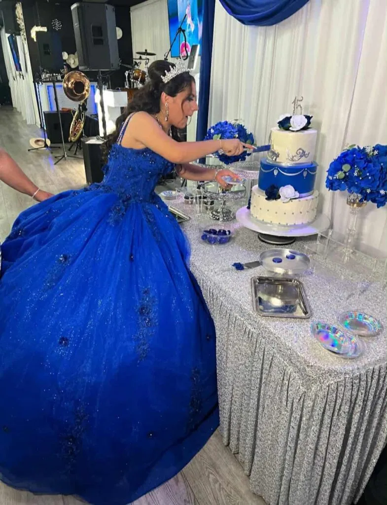 Quinceañera cutting cake at OC Salsa Venue & Banquet Hall in Fountain Valley